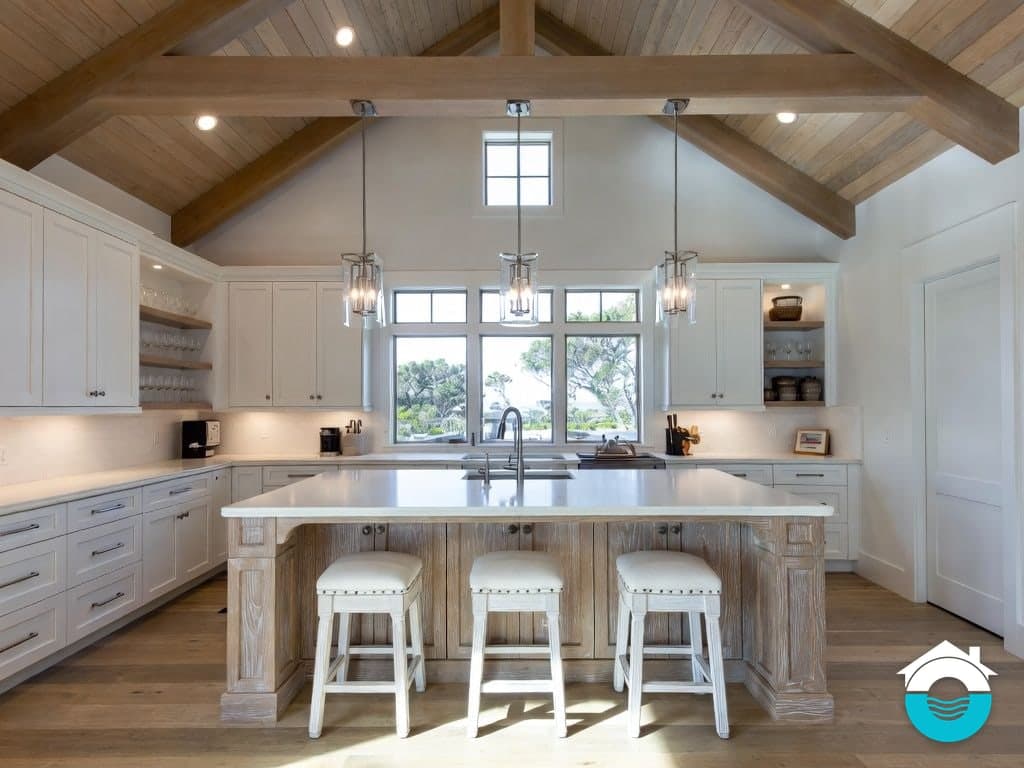 Illustration of a kitchen with a vaulted beamed ceiling, white cabinets and a whitewashed wood island